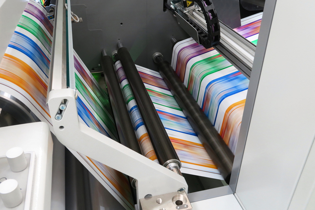 Industrial Color Printing Press with Roller System Industrial color printing machine processing printed paper through multiple rollers, illustrating an application for Parker AC30 variable frequency drives.