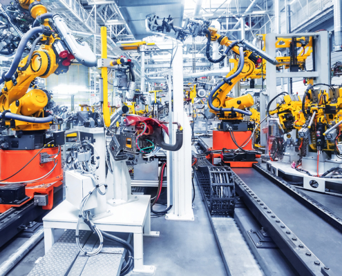 Pneumatic Solutions for Industrial Automation Industrial robotic arms operating on an automated manufacturing line.